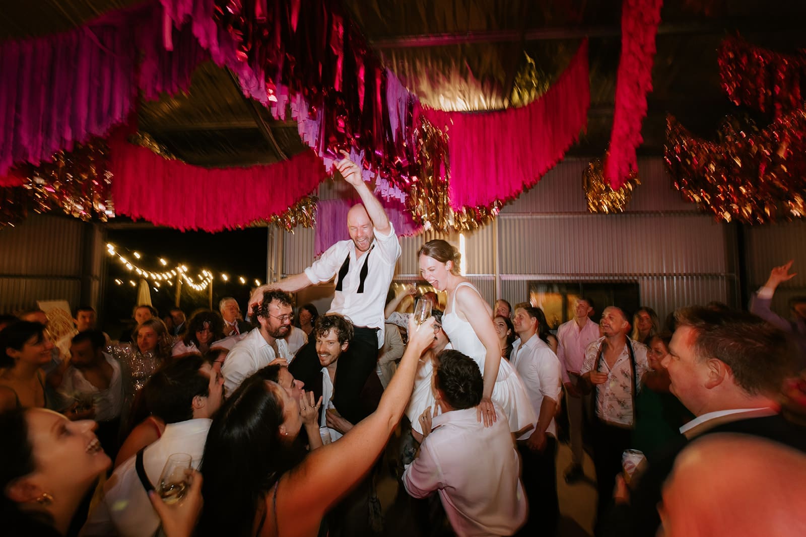 Bride and Groom On Shoulders At A Huge Melbourne Wedding